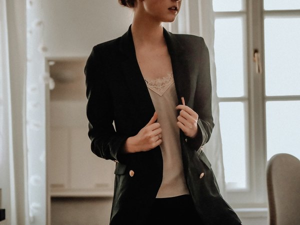 How can you style a blazer with shorts for a chic look?